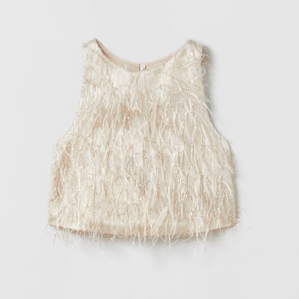 Feather top blouse gold